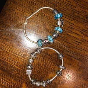 Charm bracelets with assortment of charms